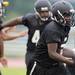 Members of the Ypsilanti Community High School football team practice in the rain at the school on Monday, August 12, 2013. Melanie Maxwell | AnnArbor.com